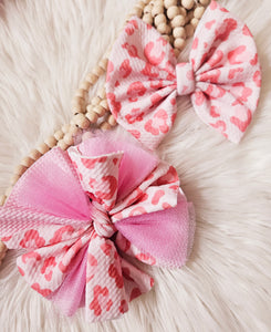 Pink leopard bows